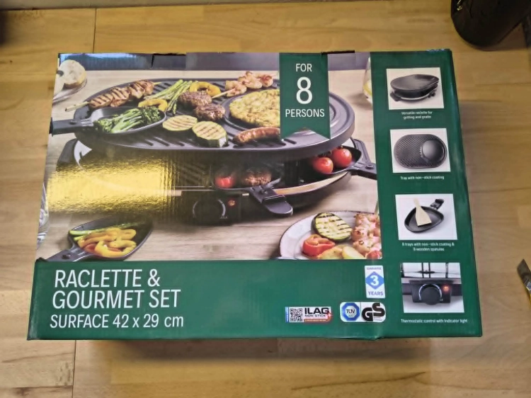 Zielono-biały oryginalny karton z grillem elektrycznym Raclette Gourmet Set 42x29 cm