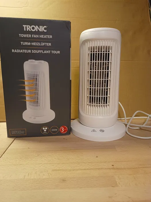 Nowy nowoczesny czarno srebrny termowentylator kolumnowy Silvercrest STHL 1500 A1 z okrągłą podstawą o wysokości 35 cm