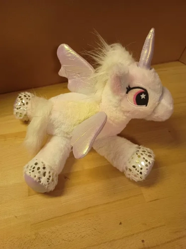 Nowy biały pluszowy jednorożec maskotka ze skrzydłami Pegaz marki Eddy Toys o długości 34 cm z cekinami na kopytkach